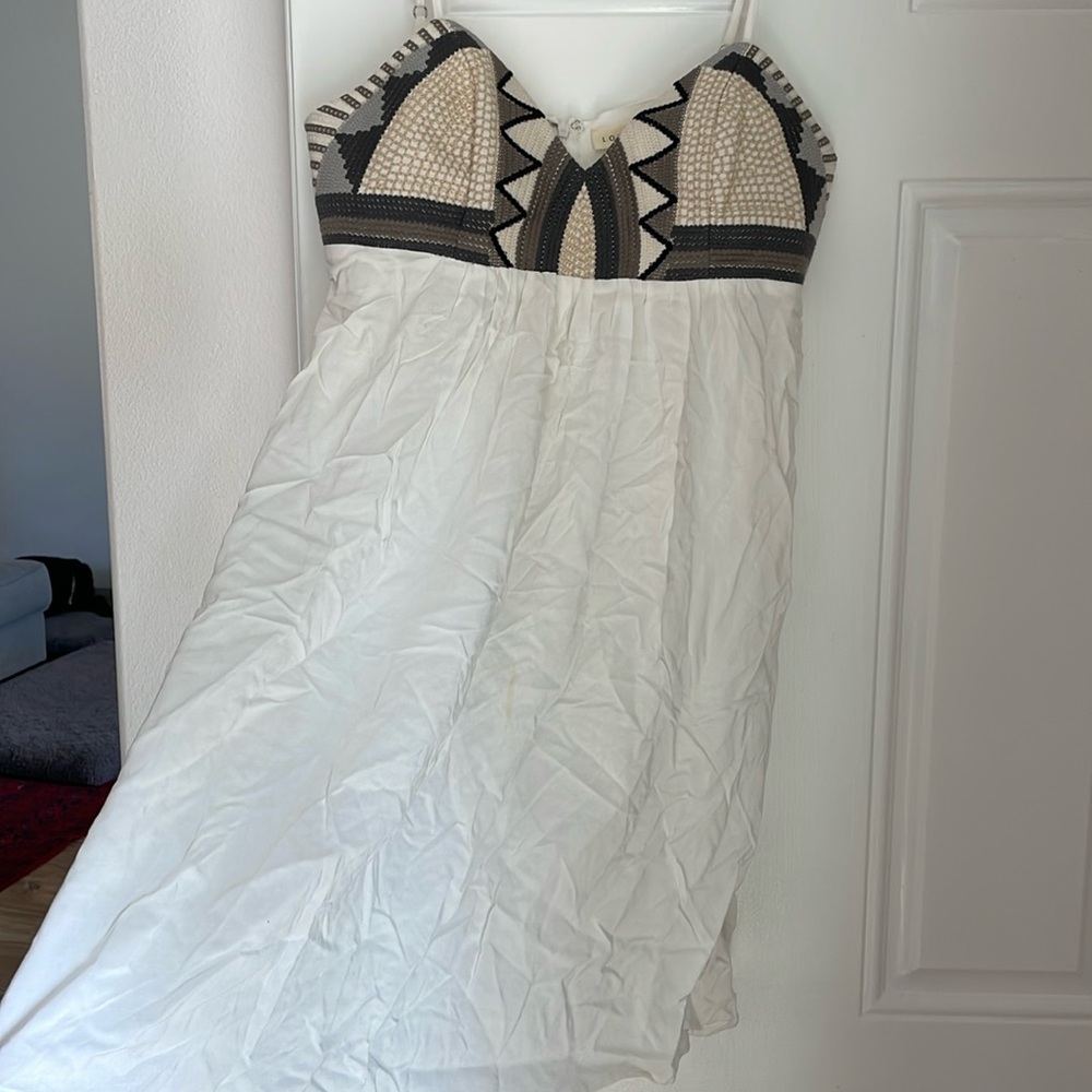 White dress with stitching and embroidering